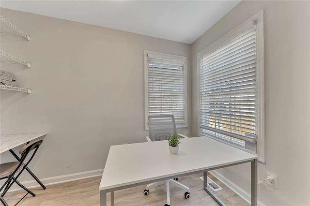 home office featuring light wood-type flooring