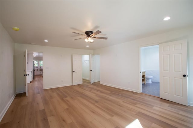 unfurnished bedroom featuring light wood-style floors, baseboards, and recessed lighting