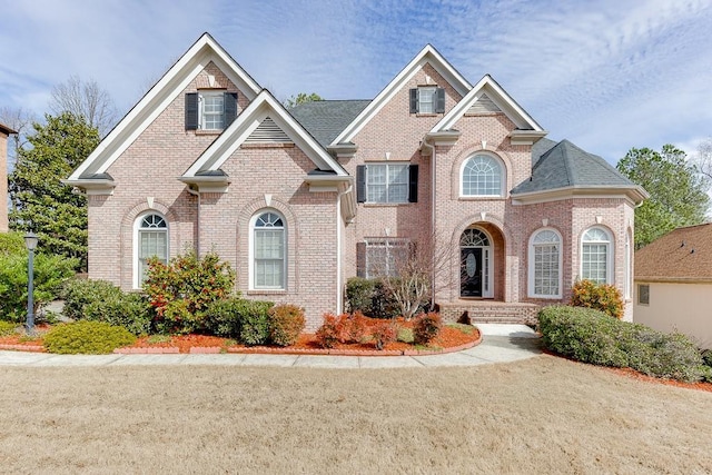 view of front of house with brick siding