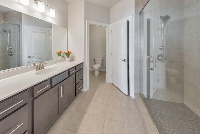 bathroom with vanity, tile patterned floors, and walk in shower