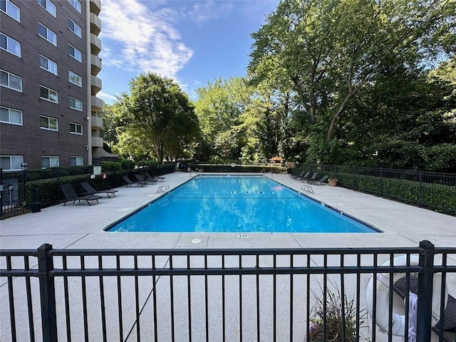 view of swimming pool with a patio