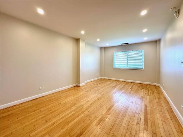 unfurnished room featuring light wood-type flooring