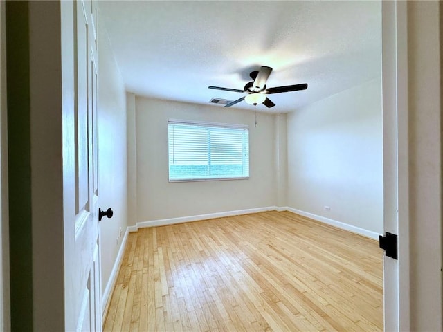 unfurnished room featuring light hardwood / wood-style floors and ceiling fan