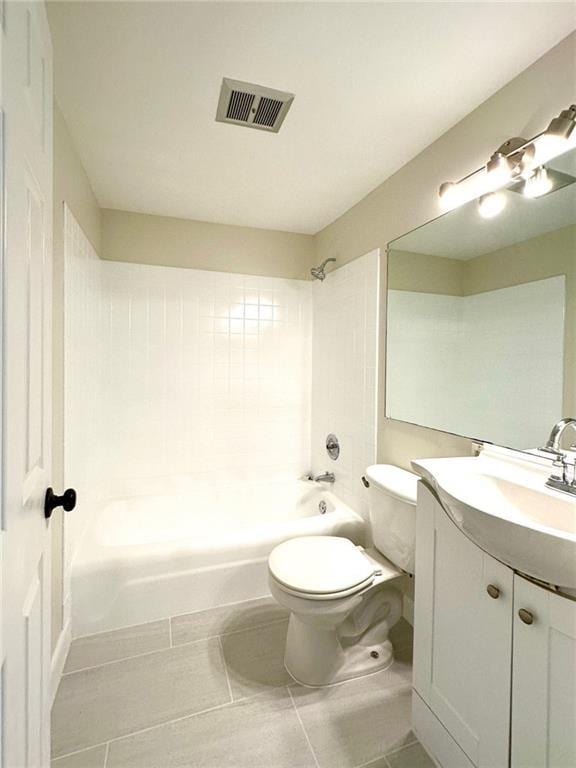 full bathroom featuring toilet, tile patterned floors, vanity, and bathtub / shower combination