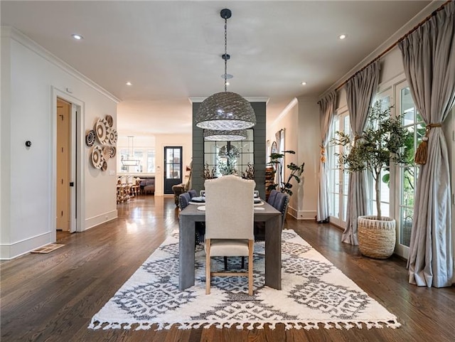 dining room with crown molding and dark hardwood / wood-style floors