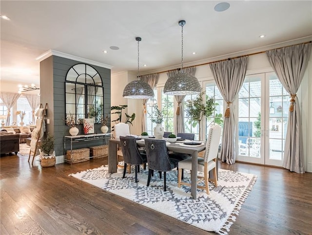 dining space featuring hardwood / wood-style floors and a healthy amount of sunlight