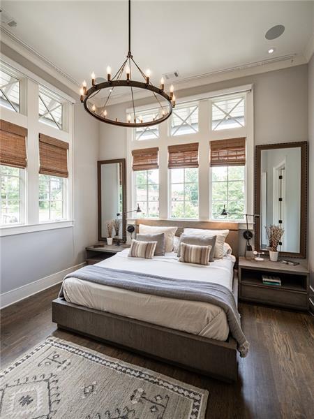 bedroom with crown molding, a chandelier, and dark hardwood / wood-style floors