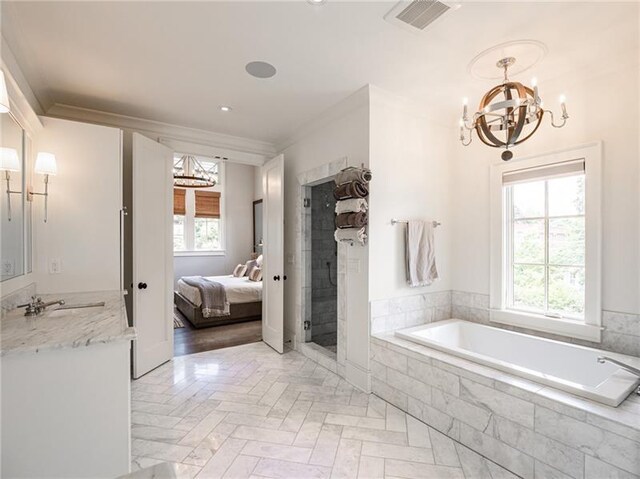 bathroom featuring a relaxing tiled tub, hardwood / wood-style floors, crown molding, a notable chandelier, and sink