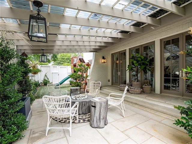 view of patio featuring french doors and a pergola