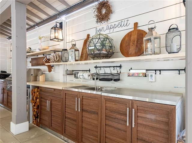 interior space featuring light tile patterned floors and sink