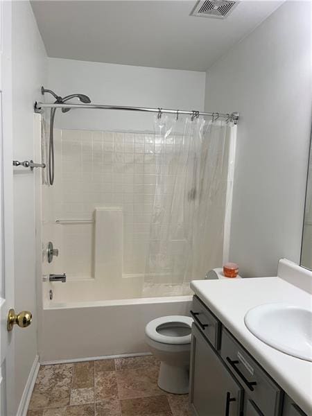 full bathroom with vanity, toilet, and shower / bath combo with shower curtain