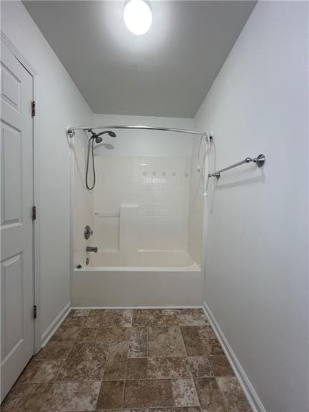 bathroom featuring washtub / shower combination