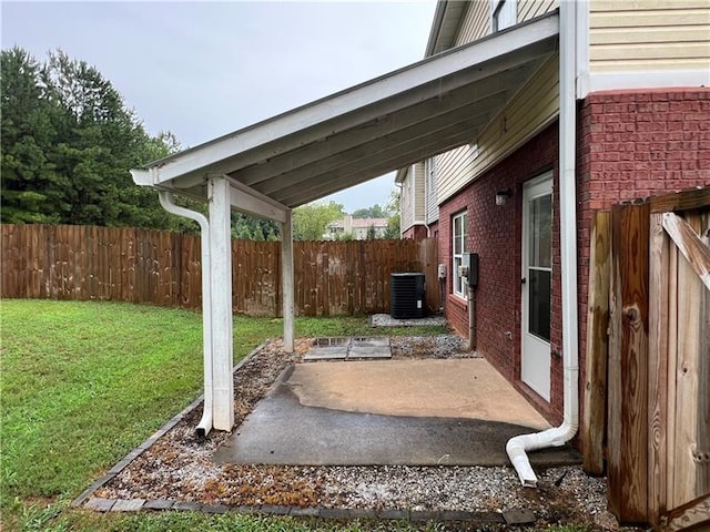 view of yard featuring a patio area and central air condition unit