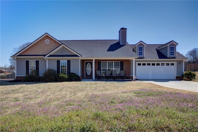 view of front facade with a garage, driveway, a front lawn, and a chimney