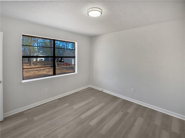 spare room with hardwood / wood-style flooring