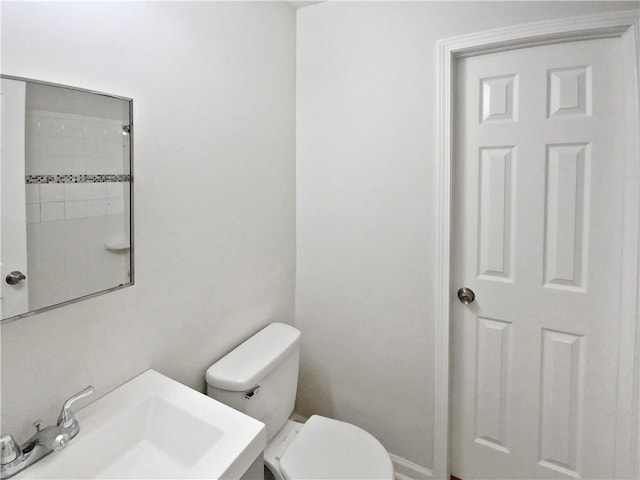 bathroom with sink and toilet