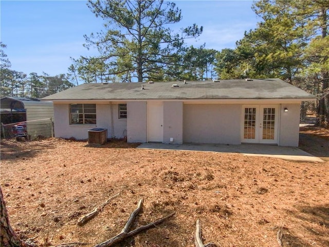 back of property with a patio and french doors