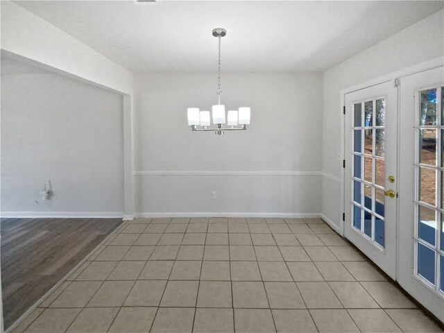 kitchen with white cabinetry, stainless steel appliances, sink, and light tile patterned floors