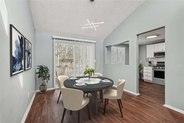 dining area with dark wood-type flooring, vaulted ceiling, and a textured ceiling