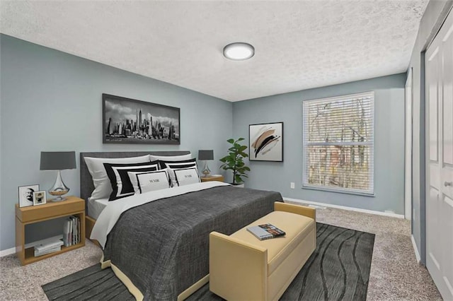 carpeted bedroom with a closet and a textured ceiling