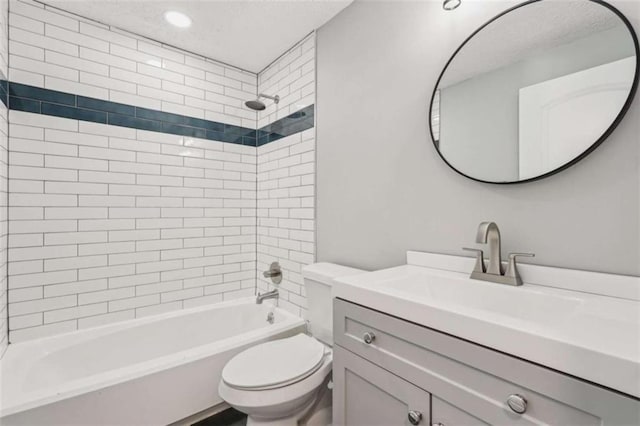 full bathroom with vanity, toilet, and tiled shower / bath