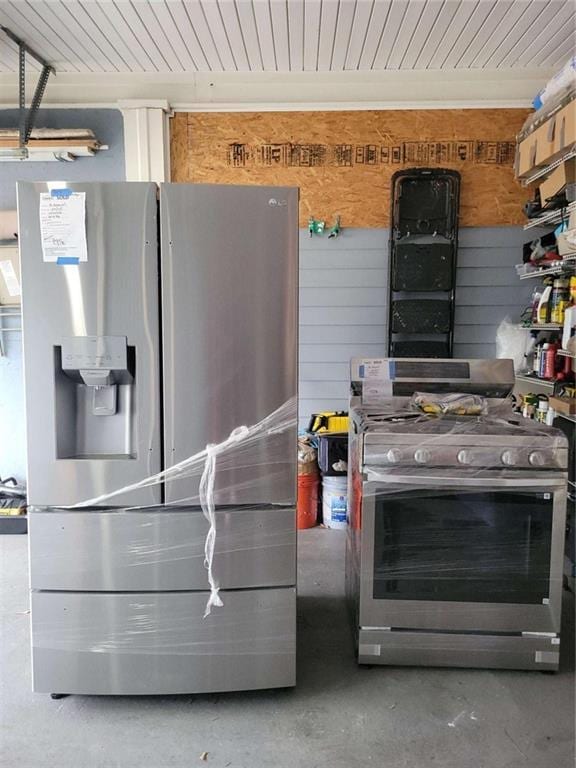 kitchen with concrete flooring, appliances with stainless steel finishes, and wood ceiling