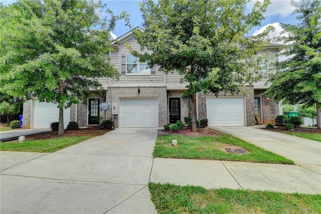 townhome / multi-family property featuring a garage