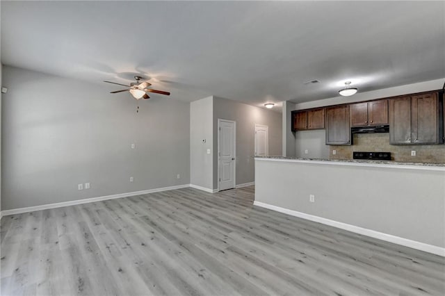 kitchen with ceiling fan, dark brown cabinets, light wood-type flooring, and exhaust hood