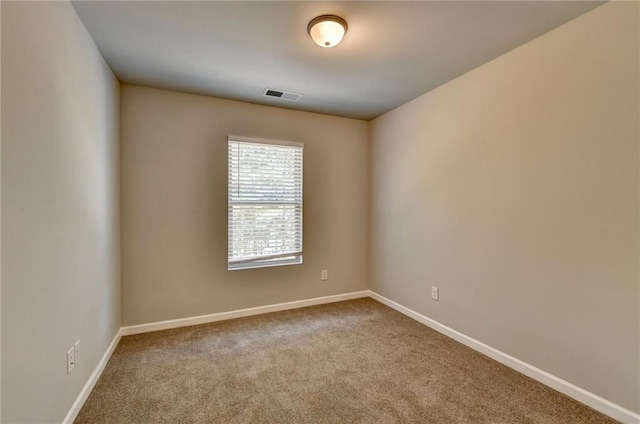 spare room with carpet floors