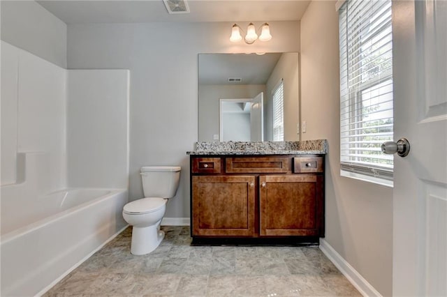 full bathroom with vanity, tub / shower combination, toilet, and tile patterned flooring