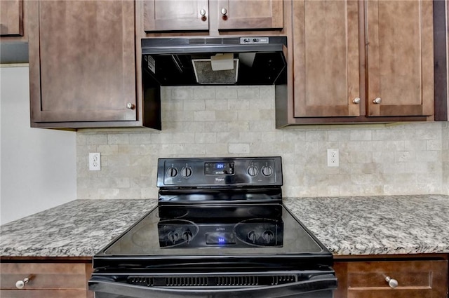 kitchen featuring tasteful backsplash and black range with electric stovetop