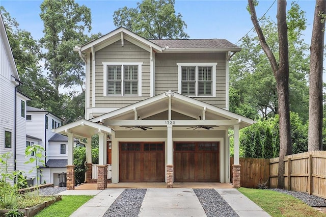 craftsman-style home with ceiling fan and a garage