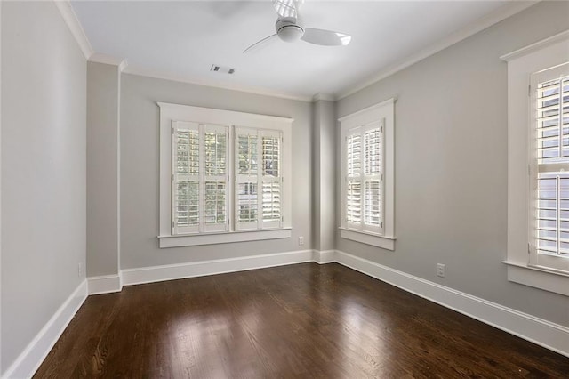 spare room featuring crown molding, dark hardwood / wood-style floors, and ceiling fan