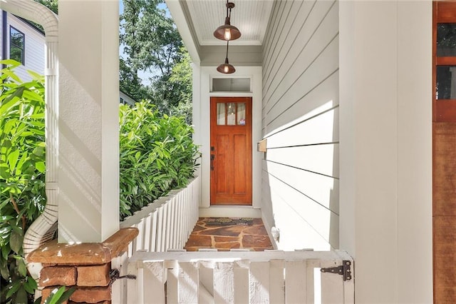 property entrance featuring covered porch