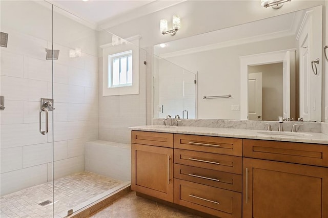 bathroom with walk in shower, tile floors, dual sinks, crown molding, and large vanity