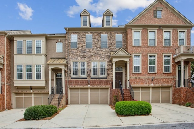 346 Ardmore Ct, Atlanta, GA 30309 - multi unit property featuring brick siding, an attached garage, and concrete driveway