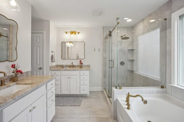 346 Ardmore Ct, Atlanta, GA 30309 - full bath featuring two vanities, a garden tub, a stall shower, and a sink