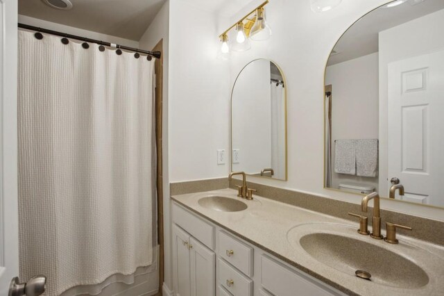 346 Ardmore Ct, Atlanta, GA 30309 - full bath with shower / bath combination with curtain, a sink, and double vanity