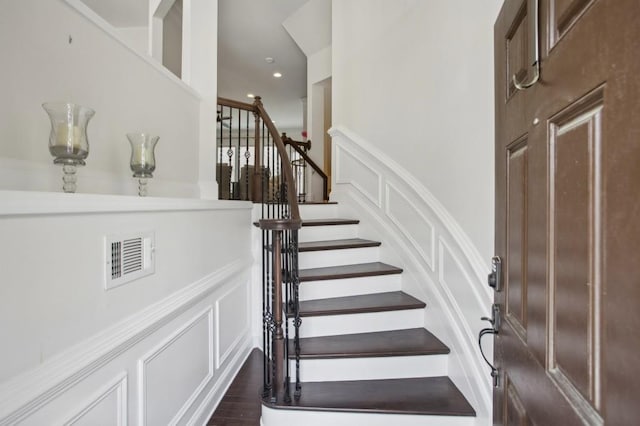346 Ardmore Ct, Atlanta, GA 30309 - stairway with a decorative wall, wood finished floors, visible vents, and recessed lighting