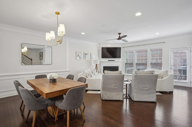 346 Ardmore Ct, Atlanta, GA 30309 - dining room featuring ceiling fan with notable chandelier, ornamental molding, a fireplace, dark wood-style flooring, and recessed lighting