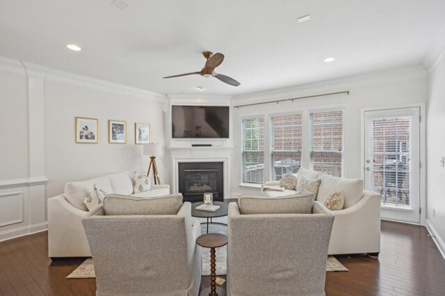 346 Ardmore Ct, Atlanta, GA 30309 - living room featuring a ceiling fan, a glass covered fireplace, ornamental molding, dark wood-type flooring, and recessed lighting