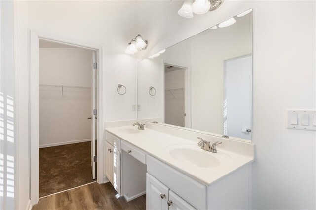 bathroom featuring vanity and wood-type flooring