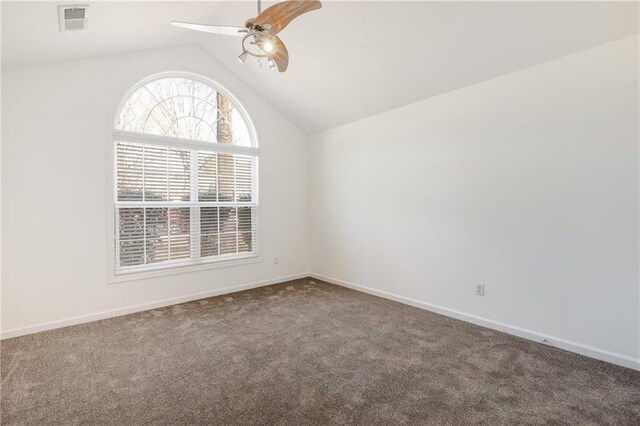 carpeted empty room featuring ceiling fan and lofted ceiling