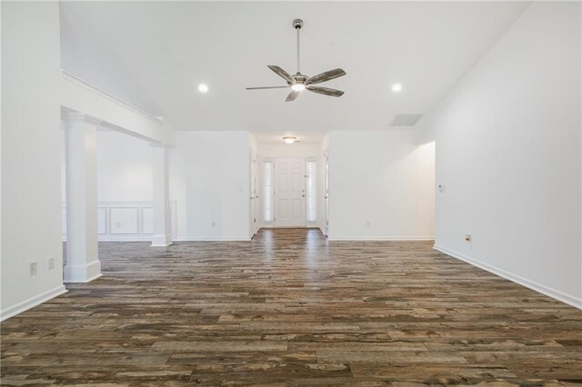 unfurnished living room with ceiling fan and dark hardwood / wood-style flooring