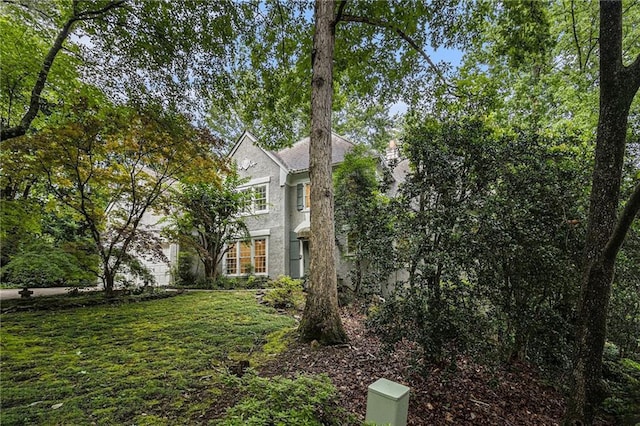 80 Stratford Pl NE, Atlanta, GA 30342 - view of property exterior featuring stucco siding and a yard