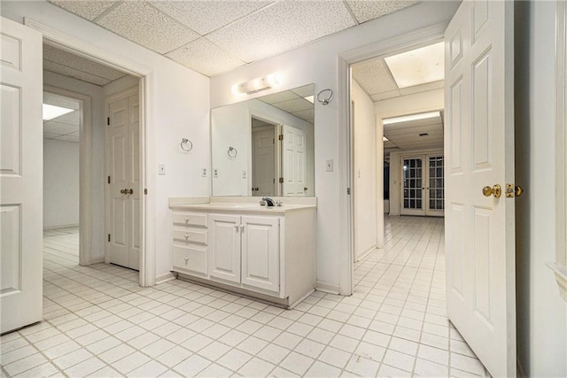 80 Stratford Pl NE, Atlanta, GA 30342 - bathroom with a drop ceiling, vanity, and tile patterned flooring