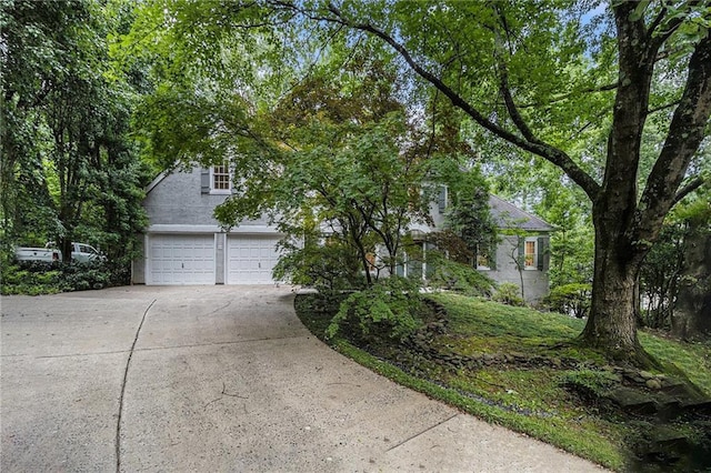 80 Stratford Pl NE, Atlanta, GA 30342 - obstructed view of property featuring driveway and an attached garage