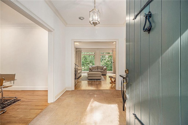 80 Stratford Pl NE, Atlanta, GA 30342 - entrance foyer featuring crown molding and a chandelier