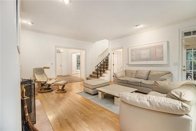 80 Stratford Pl NE, Atlanta, GA 30342 - living area with ornamental molding, stairway, and wood finished floors
