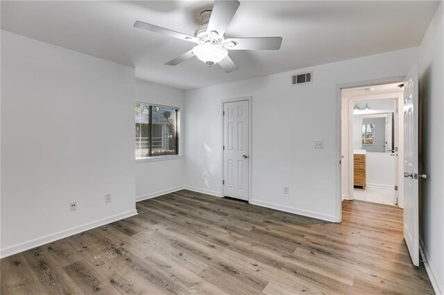 unfurnished bedroom with hardwood / wood-style floors and ceiling fan